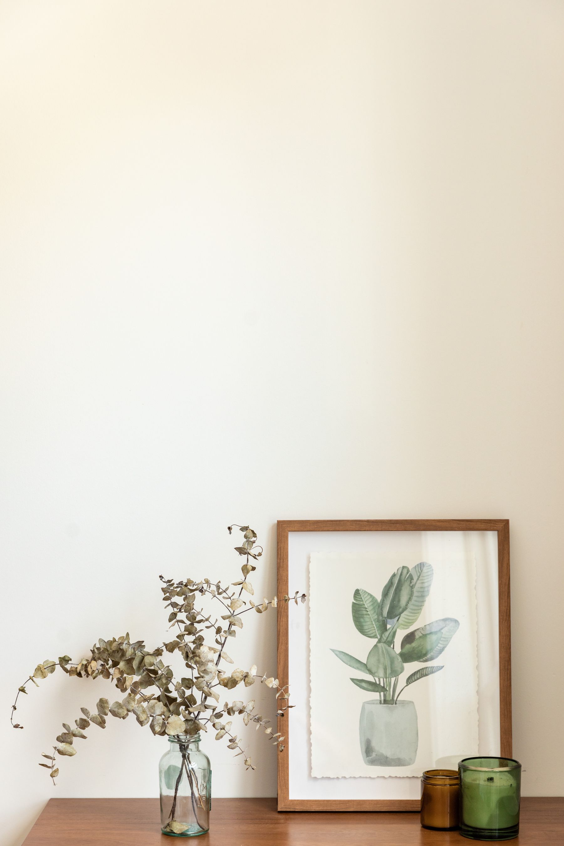 A calm, warmly lit interior with dried botanicals